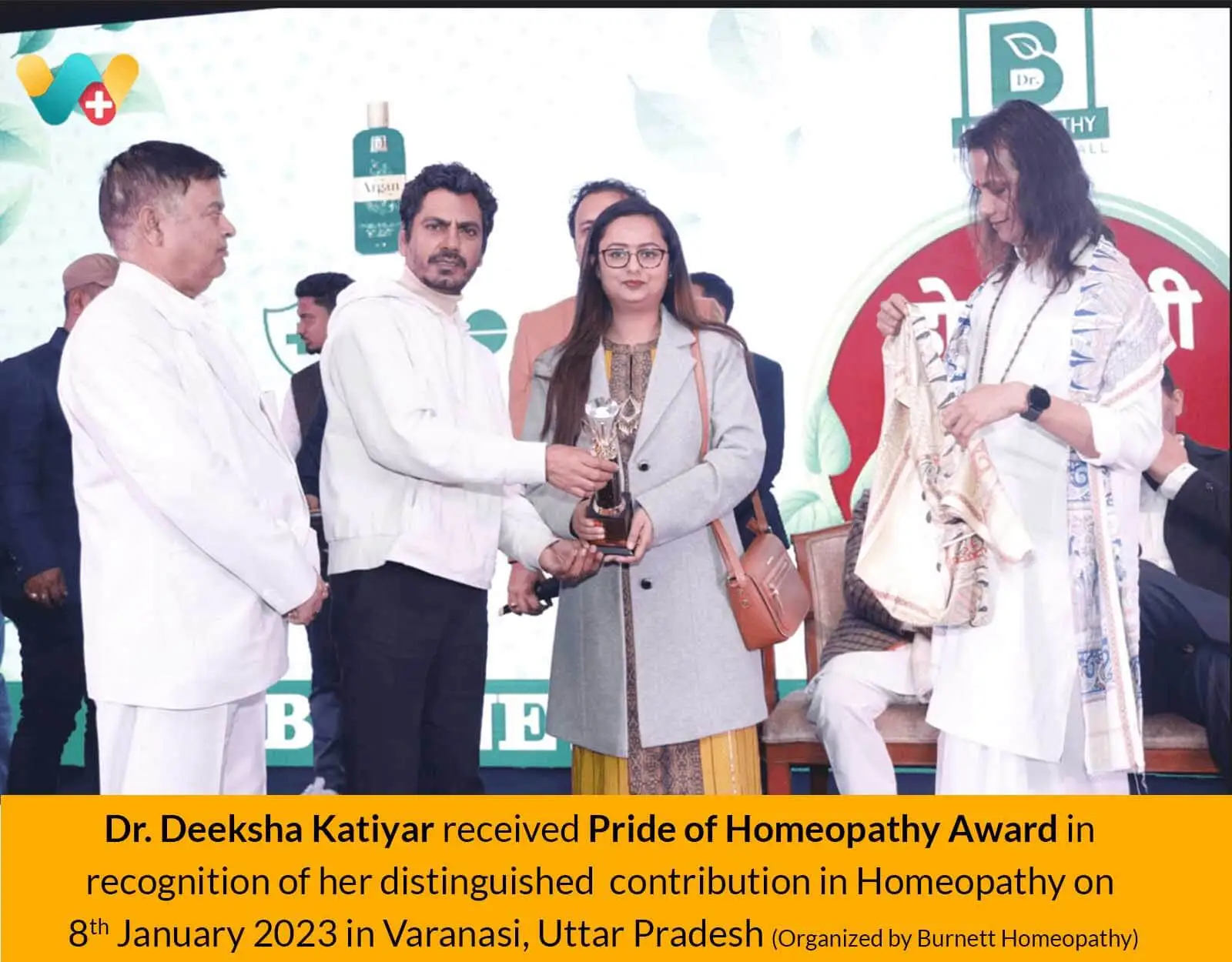 Dr. Deeksha Katiyar Receiving Award from Nawazuddin